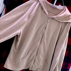 A tan velvet zip up jacket